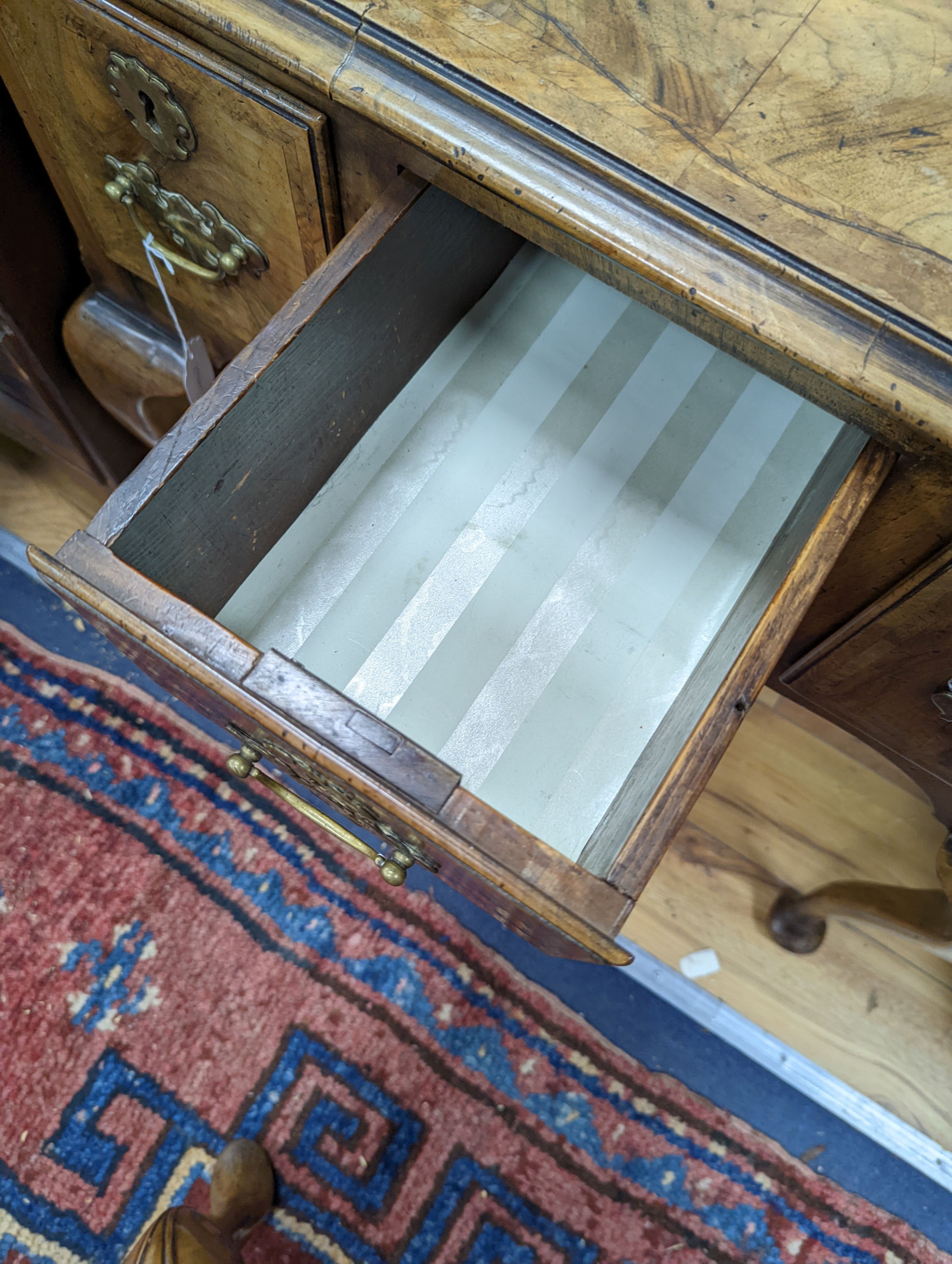 A 1920's Queen Anne revival banded walnut lowboy, width 76cm, depth 51cm, height 75cm together with a similar rectangular walnut dressing stool